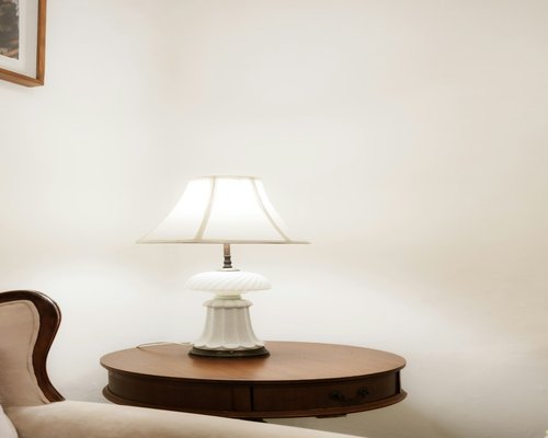 Soft room lighting with a tablet reading setup on a side table